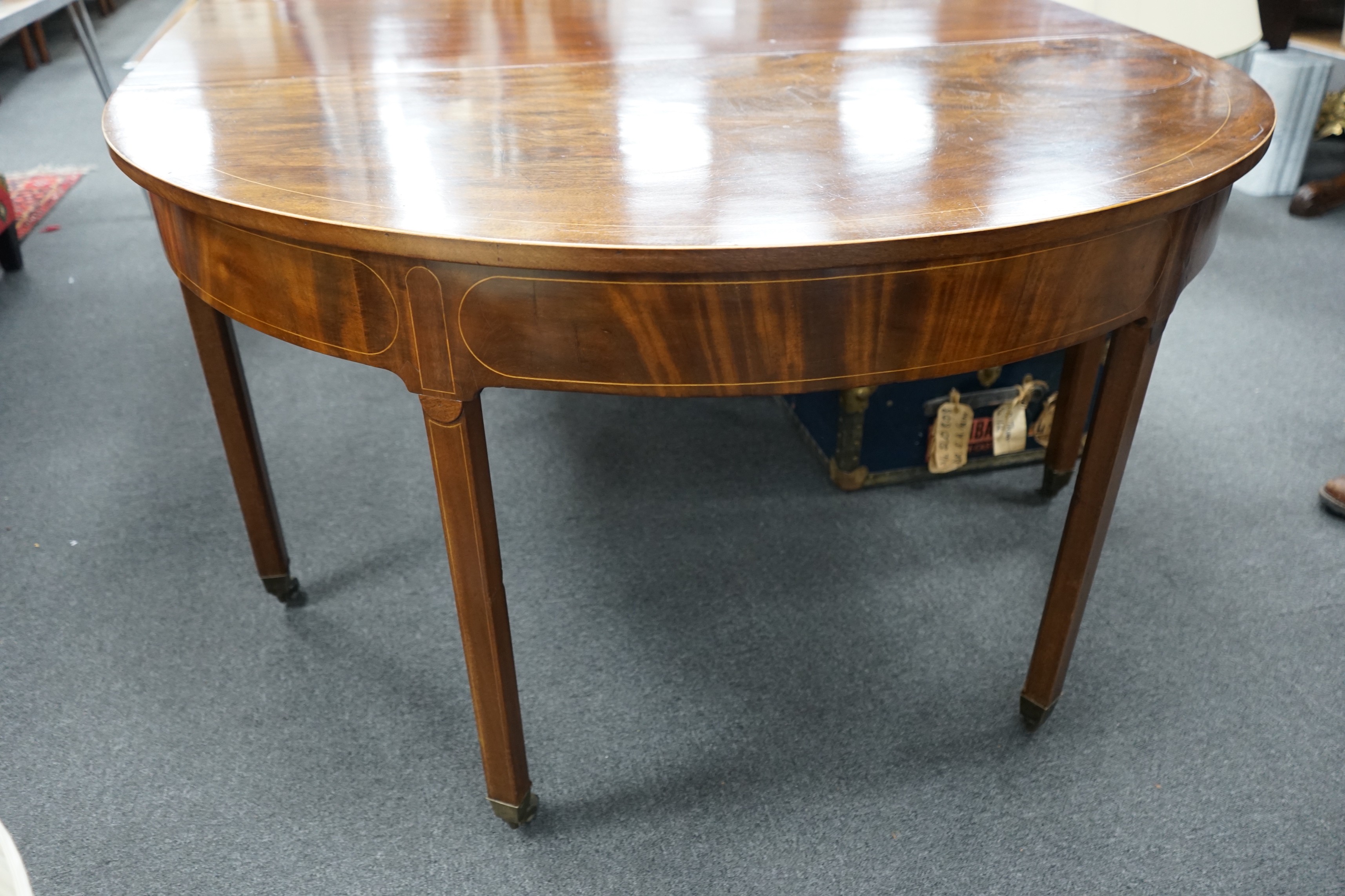 A George III, possibly Irish, mahogany D end extending dining table, length 190cm, 260cm extended, two spare leaves, width 136cm, height 76cm